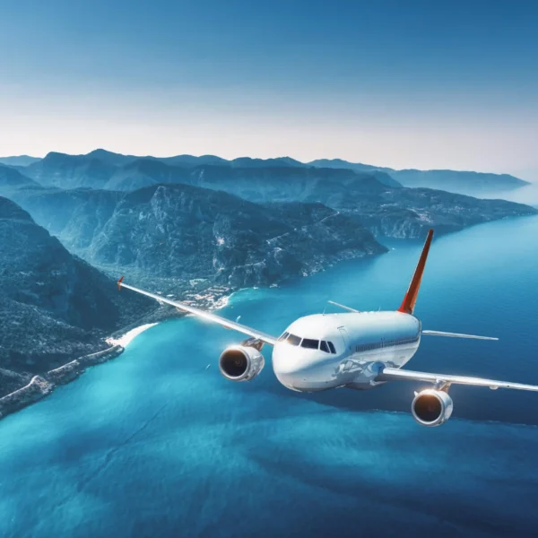 aircraft-is-flying-islands-sea-sunrise-summer-landscape-with-white-passenger-airplane